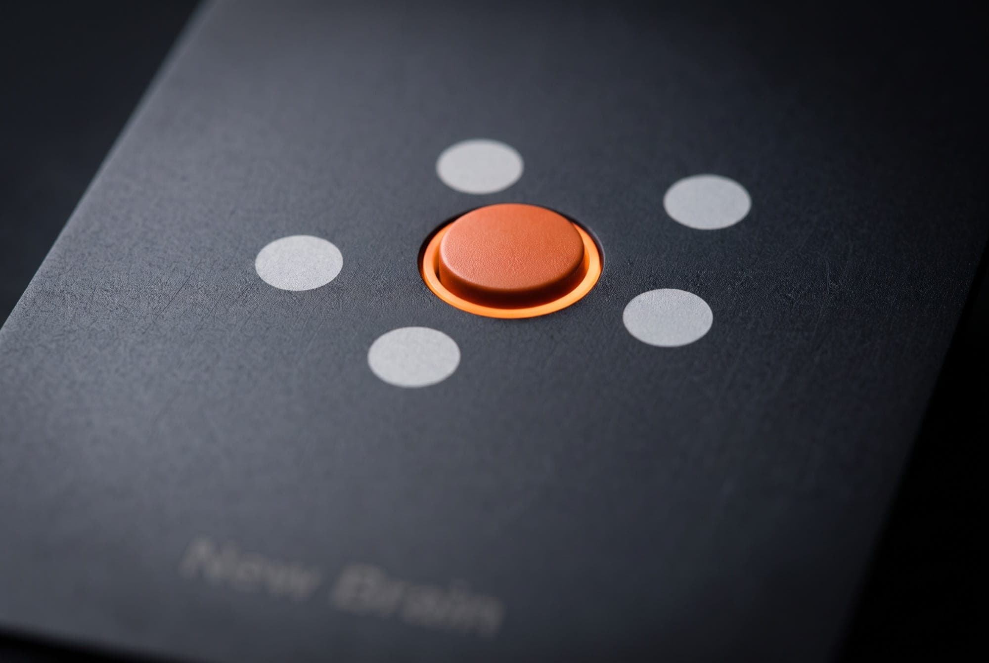 Close-up of the orange core and the five dots around it on New Brain Card